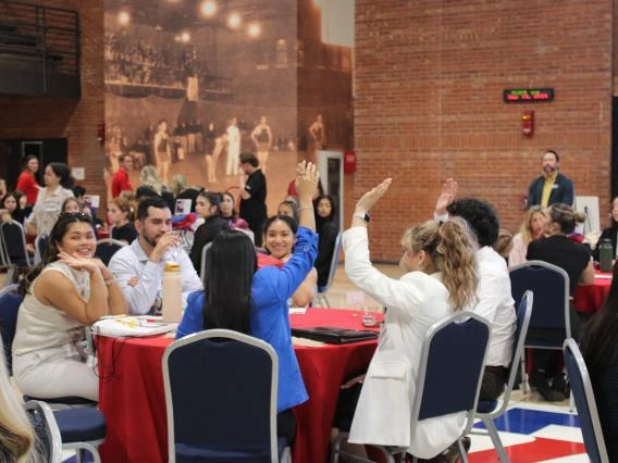 students gathered around a table