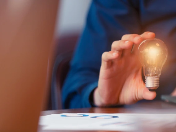 person holding lightbulb