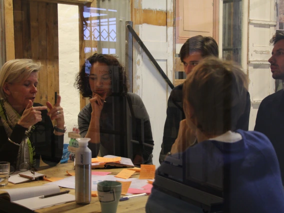 Image of Claire Bates and 4 colleagues at a table