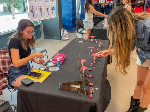 Undergraduate in fine arts Ava Jo Schuldt sells the jewelry she makes through the Student-Made program.