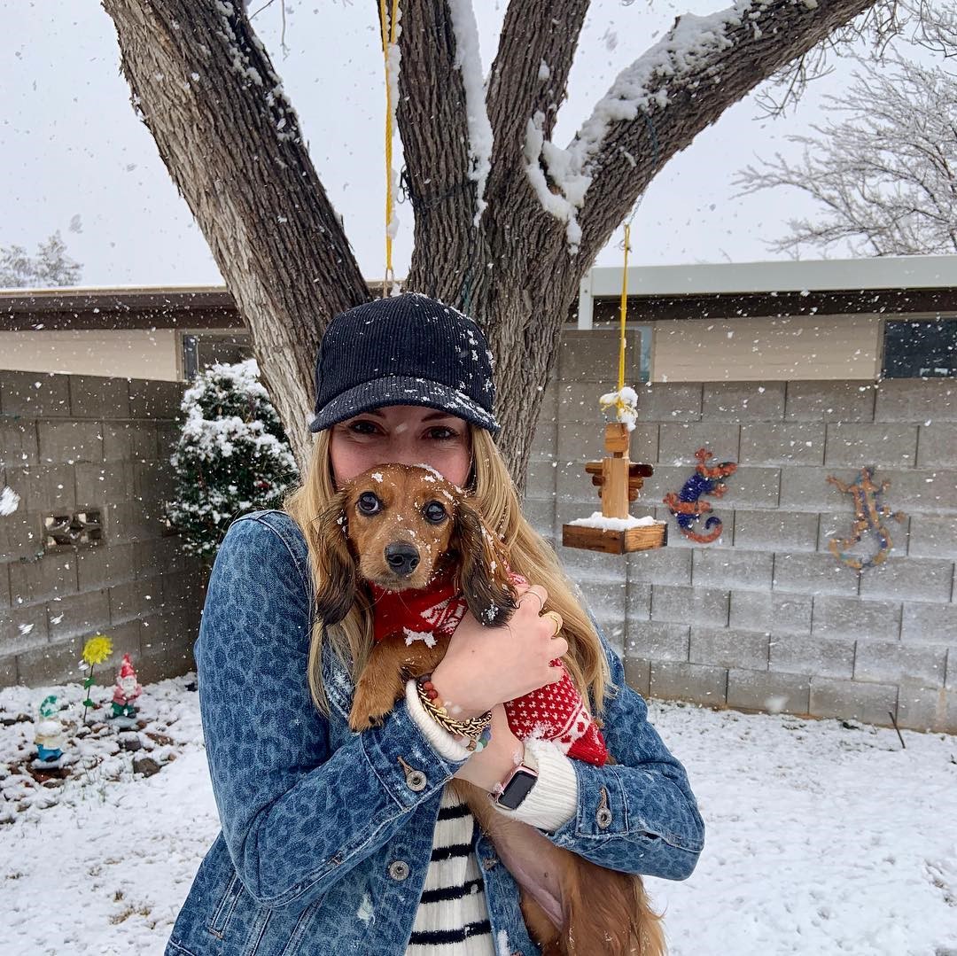 Karlie Fisher and her dog in the snow