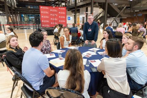 Students and Teacher talking at the 2023 Retail Fuse Event